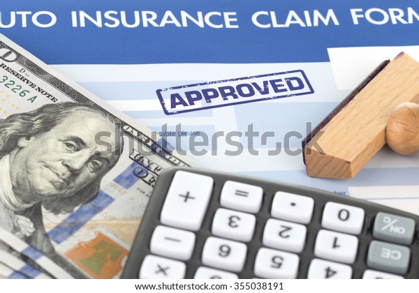 auto insurance\
claim form with stamp\
approved