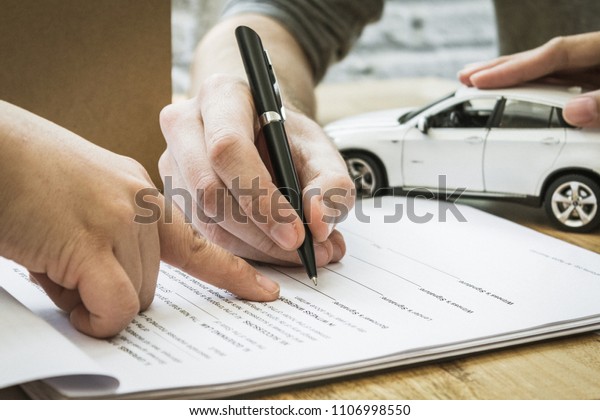 Auto insurance policy signature.  Home owners\
insurance paperwork.
