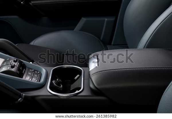 Auto interior detail.\
Leather armrest.