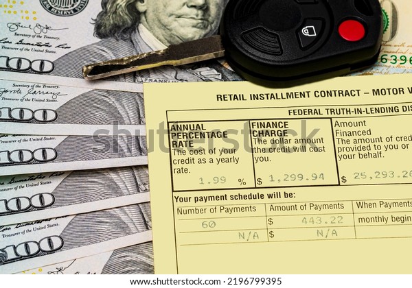 Auto loan contract, car key and cash money.\
Interest rate, credit and debt\
concept.
