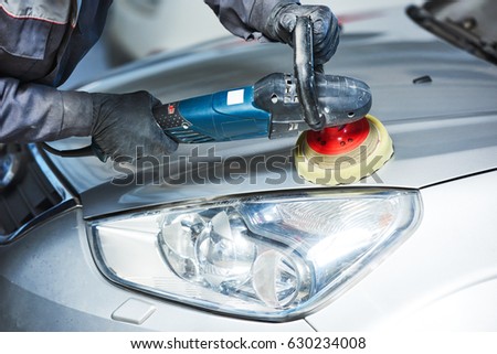 auto mechanic buffing car autobody bonnet