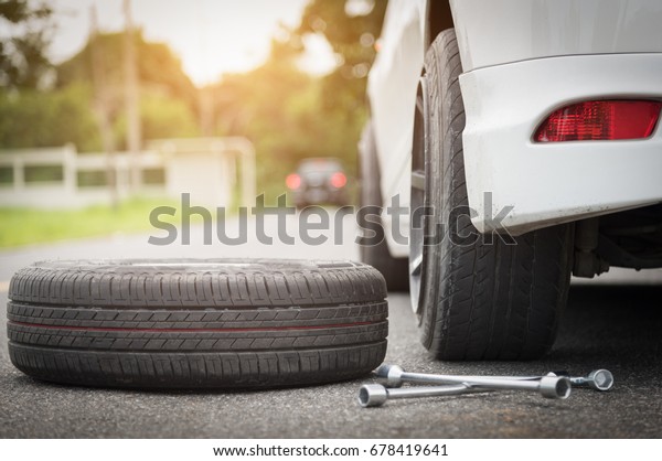 Auto mechanic changing wheel,Changing tires repair\
cracked tires.