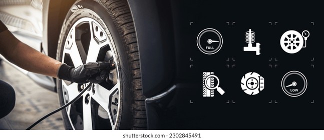 Auto mechanic checking air pressure and inflating car tires with service icons. Concept of car care servicing and maintenance or fix the car leaky or flat tire. - Shutterstock ID 2302845491