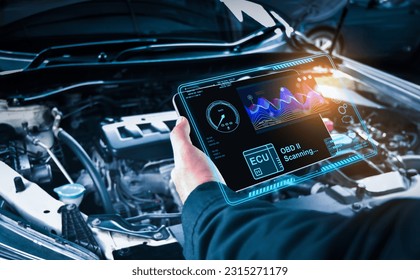 Auto mechanic checking ECU engine system with OBD2 wireless scanning tool and car information showing on screen interface,Car maintenance service concept.