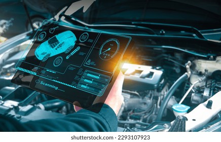 Auto mechanic checking engine system with OBD2 wireless scanning tool and car information showing on screen interface,Car maintenance service concept.
