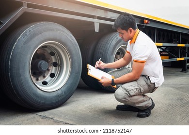 Auto Mechanic is Checking the Truck's Safety Maintenance Checklist. Inspection Truck Safety of Semi Truck Wheels Tires.	