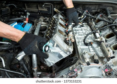 The auto mechanic deconstructs the internal combustion engine