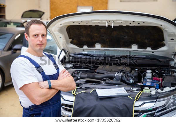 An auto mechanic does maintenance to the car.\
Writes information about the\
car.
