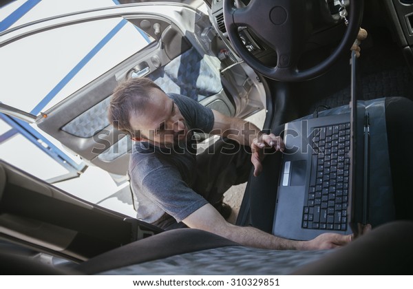 Auto Mechanic Doing\
Diagnostic Test