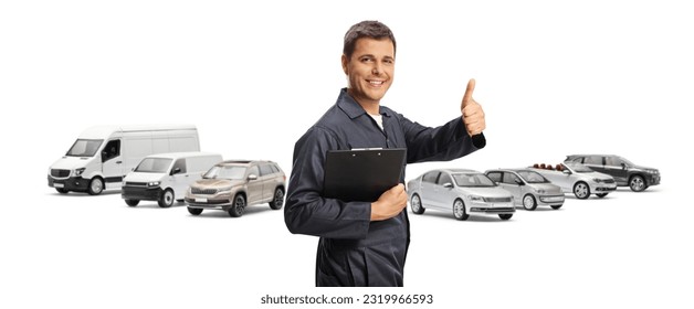 Auto mechanic holding a clipboard and gesturing thumbs up in front of many parked vehicles

 - Powered by Shutterstock