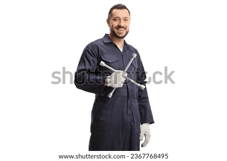 Auto mechanic holding a lug wrench isolated on white background