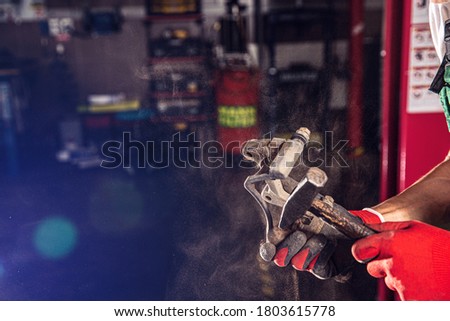 Auto mechanic makes the maintenance. Auto car repair service center.