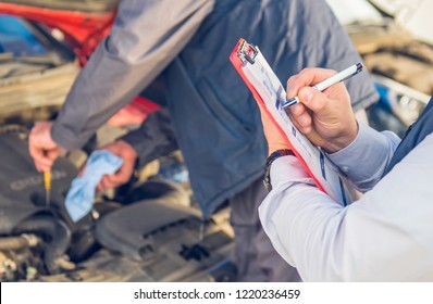 Auto Mechanic Perform Vehicle Checkup While Service Advisor Take Notes - Professional Auto Service Technician - Concept Of Inspecting And Taking Care Of The Car