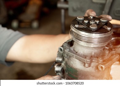 Auto Mechanic Repair Automotive Air Conditioning Compressor.selective Focus.