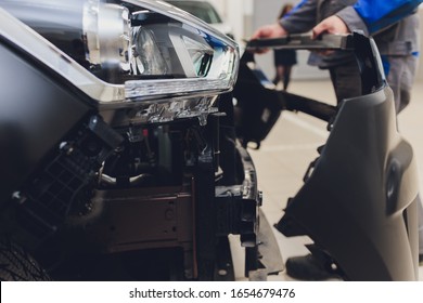 Auto Mechanic Repair Car Body Bumper Replacement.