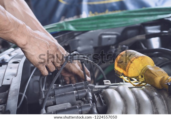 Auto mechanic\
Repair service. Car repair, maintenance and vehicle inspection\
concept. Mechanic Engineering\
