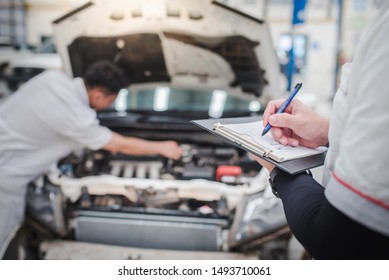 Auto Mechanic In Auto Repair Shop Checking Engine For Customers Who Come To Use The Car Inspection Service Mechanic Working In Car Service Center