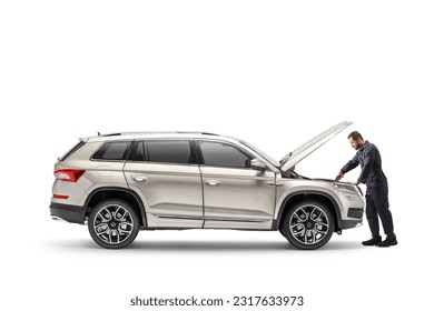 Auto mechanic repairing a SUV with an open hood isolated on white background