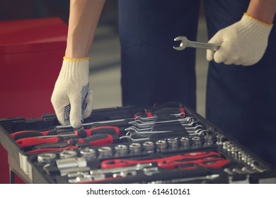 Auto Mechanic Selecting Tools In Car Repair Shop, Closeup