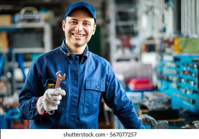 Auto Mechanic Smiling In His Garage