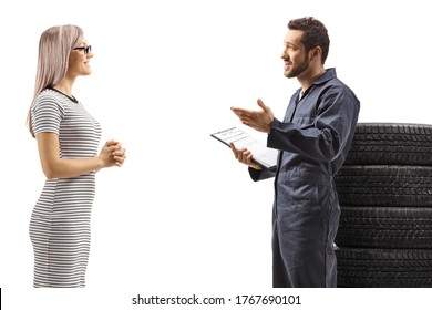 Auto Mechanic Talking To A Young Woman Customer Isolated On White Background