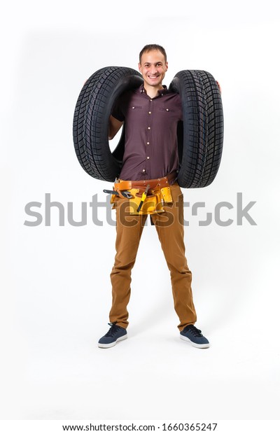 Auto mechanic\
with tools on a white\
background
