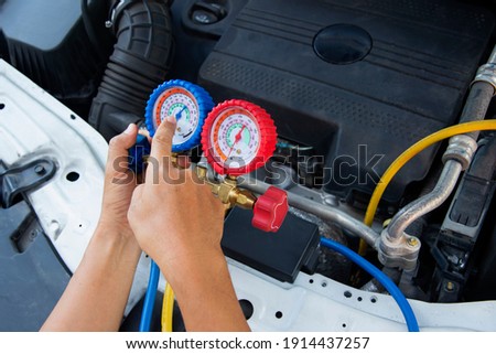 Auto mechanic uses a The pressure gauge on the air compressor,liquid air pressure,compressor,manometer