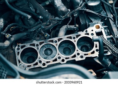 Auto mechanic working in garage. Repair service. The connecting rod, piston and cylinder block in a disassembled condition. maintenance repair at car service station for diagnosis. High quality photo