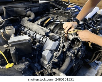 Auto mechanic working in garage. Repair service. High quality photo