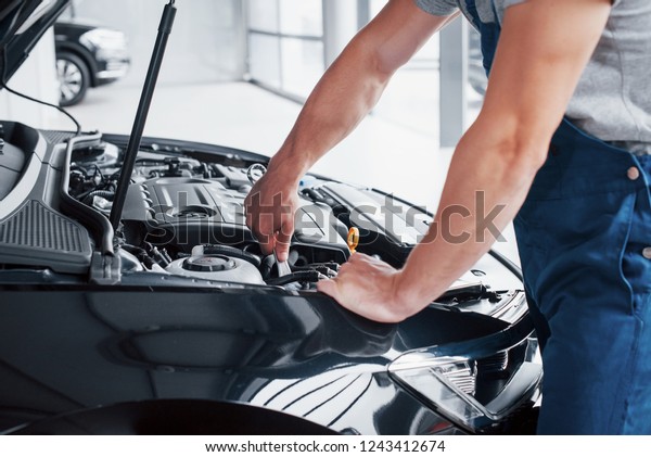 Auto mechanic\
working in garage. Repair\
service