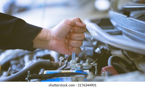 Auto Mechanic Working In Repair Service Garage. Repair Service Center Concept, Expert Repair Technicians In Modern Service Centers.