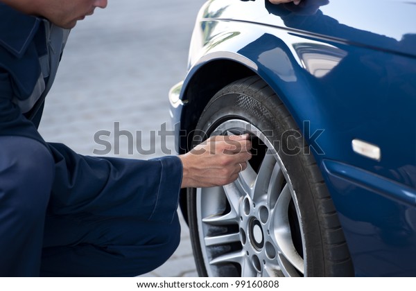 Auto mechanic/Service station worker  reviews\
necessary repairs or\
inflating