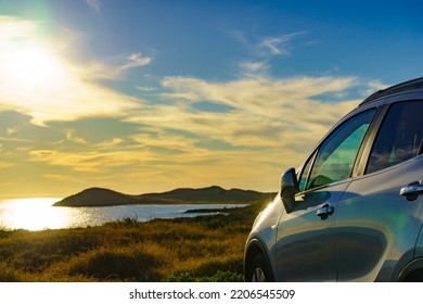 Auto Parking On Seashore In Sunset Time. Rear View Mirror Closed For Safety At Car Park.