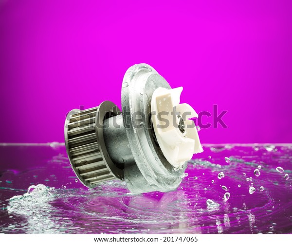 Auto parts, engine cooling pump in spurts of\
water on purple gradient\
background.