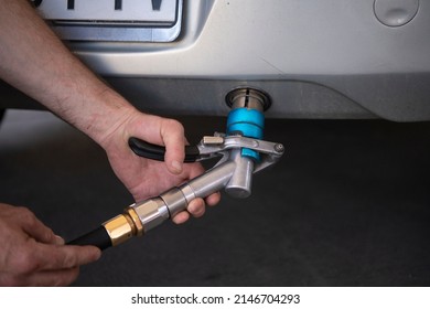 Auto Refuel. Car At Gas Station Being Filled With Fuel, Fill Up Of Liquefied Petroleum Gas, LPG Or TNG. Hand Holding LPG Dispenser.