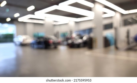 Auto Repair Service Station - Electric Lift For Lifting Cars That Come To Change The Engine Oil Periodically In The Car Care Center. Blur Background