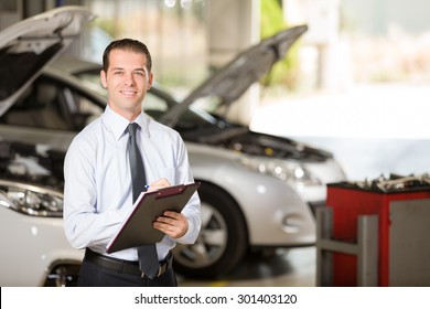 Auto Repair Shop Manager Posing At Camera.