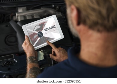 Auto Repair Shop Owner Checking Tablet Concept