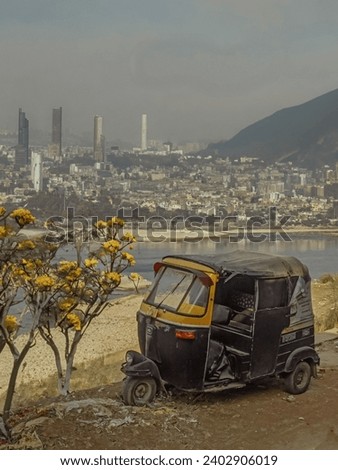 Auto Rikshaw alongside the River.