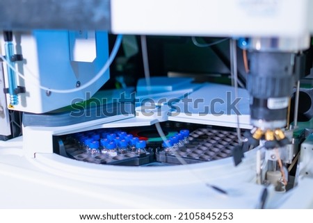 Auto sample with glass vials and blue caps for HPLC analysis of the biological samples. Research of oncological diseases. 