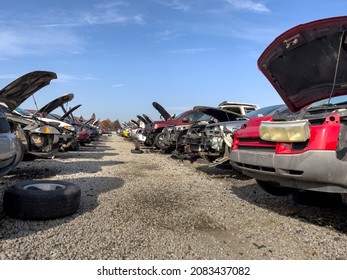 Auto scrap junkyard. Recycling of wrecked automobile used car parts. - Shutterstock ID 2083437082