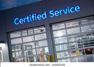 Auto Service. Certified Car Service Gates At Night.