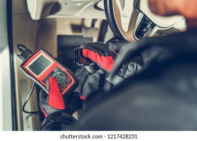 Auto Service Diagnostic Tool in Hands of Vehicle Maintenance Worker. Car Computer Error Reading Using Mobile Device. 