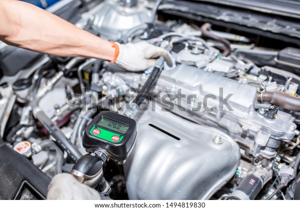 Auto service.\
The master checks the oil level, checks and changes auto parts, an\
air-purifying filter, pours in coolant, and performs maintenance.\
Modern universal auto\
center.