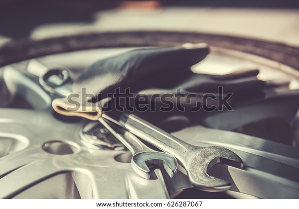 At the auto service. Auto mechanic's equipment.
Tools, gloves on wheel