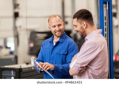 Auto Service, Repair, Maintenance And People Concept - Mechanic With Clipboard Talking To Man Or Owner At Car Shop