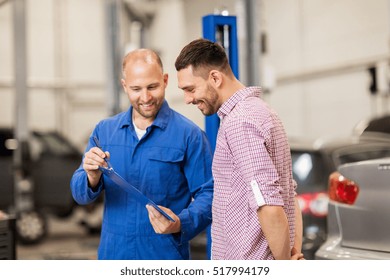 Auto Service, Repair, Maintenance And People Concept - Mechanic With Clipboard Talking To Man Or Owner At Car Shop