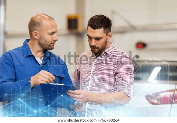 auto
service, repair, maintenance and people concept - mechanic with
clipboard talking to man or owner at car
shop