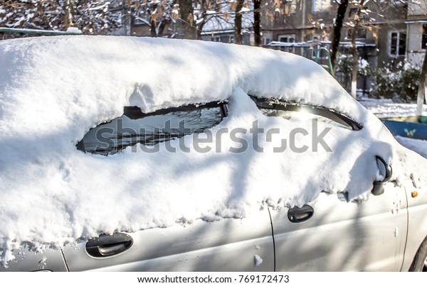 Auto under snow in\
winter