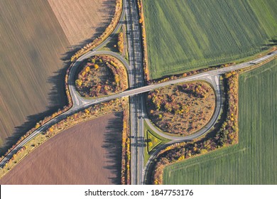 Autobahn In Germany As Seen From Above. Aerial View Of Freeway Ramp And Exit.